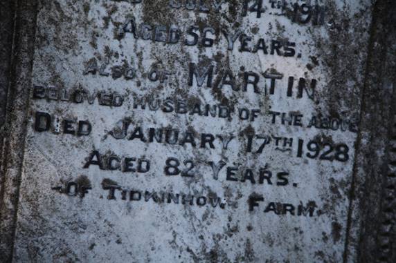 Close-up of a grave stone

Description automatically generated