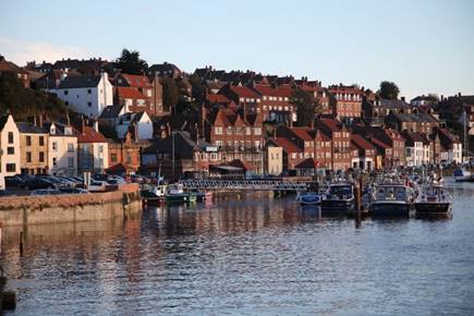 A city with many houses on the water

Description automatically generated with medium confidence