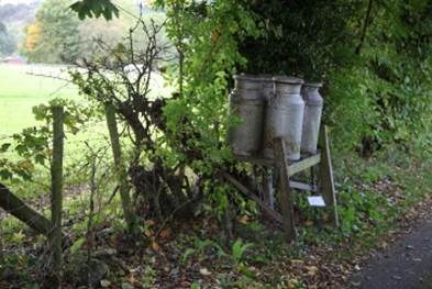 Several metal containers on a stand

Description automatically generated