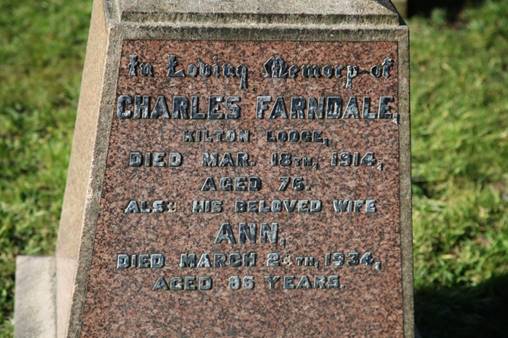 A close-up of a grave stone

Description automatically generated