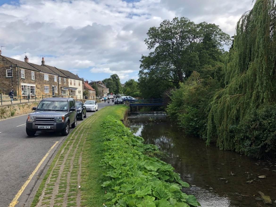 A car parked on the side of a road

Description automatically generated