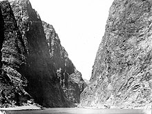 A black and white photo of a canyon

Description automatically generated