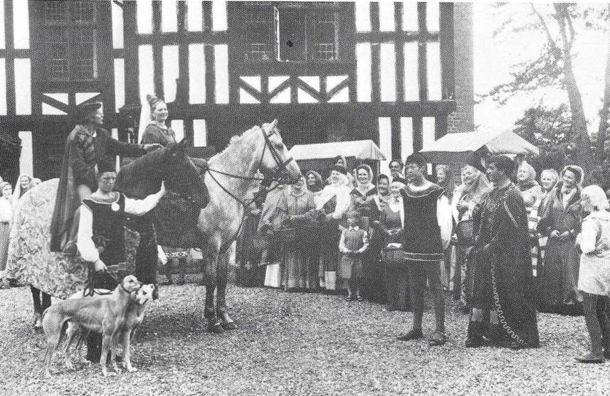 A group of people standing on horses
Description automatically generated