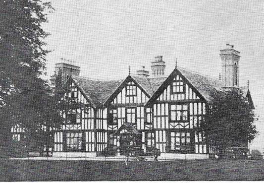 A black and white photo of a house

Description automatically generated