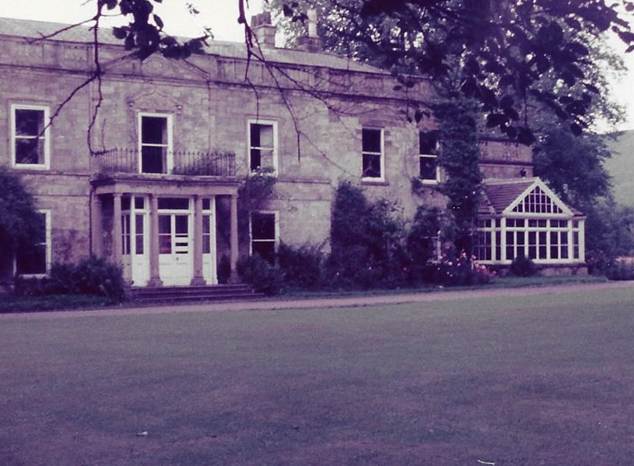 A house with a lawn and a building

Description automatically generated with medium confidence