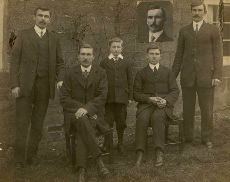 A group of men in suits
Description automatically generated