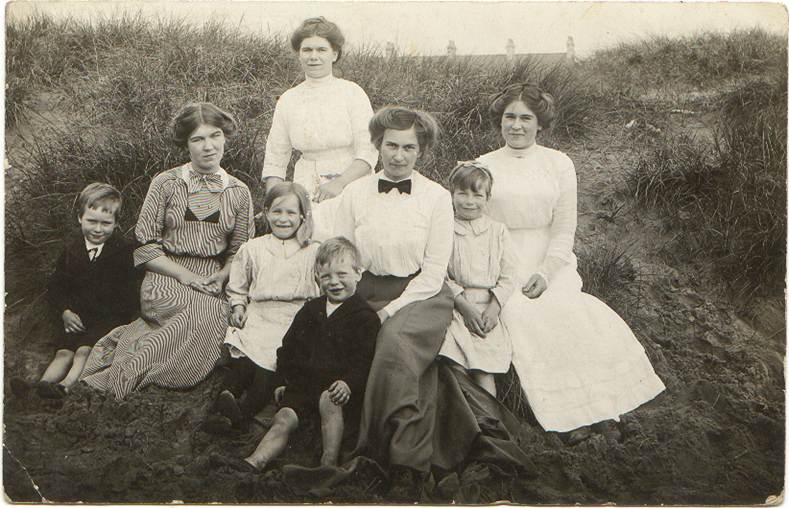 A group of people posing for a photo
Description automatically generated