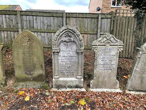 A group of tombstones in a cemetery

Description automatically generated with low confidence