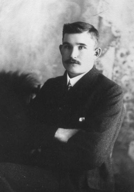 A person with his arms crossed

Description automatically generated