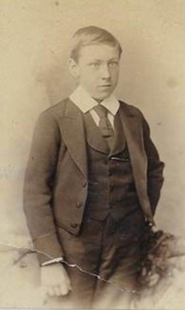 A young person in a suit

Description automatically generated