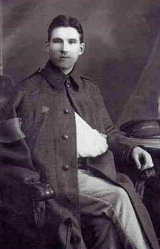 A person in a military uniform
Description automatically generated