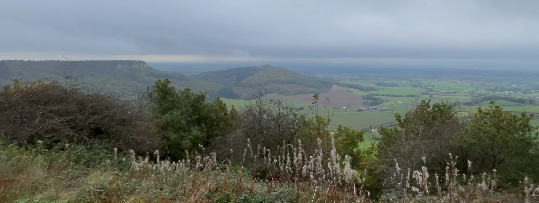 A view of a hill and a valley
Description automatically generated with medium confidence