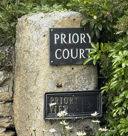 A stone pillar with a sign

AI-generated content may be incorrect.