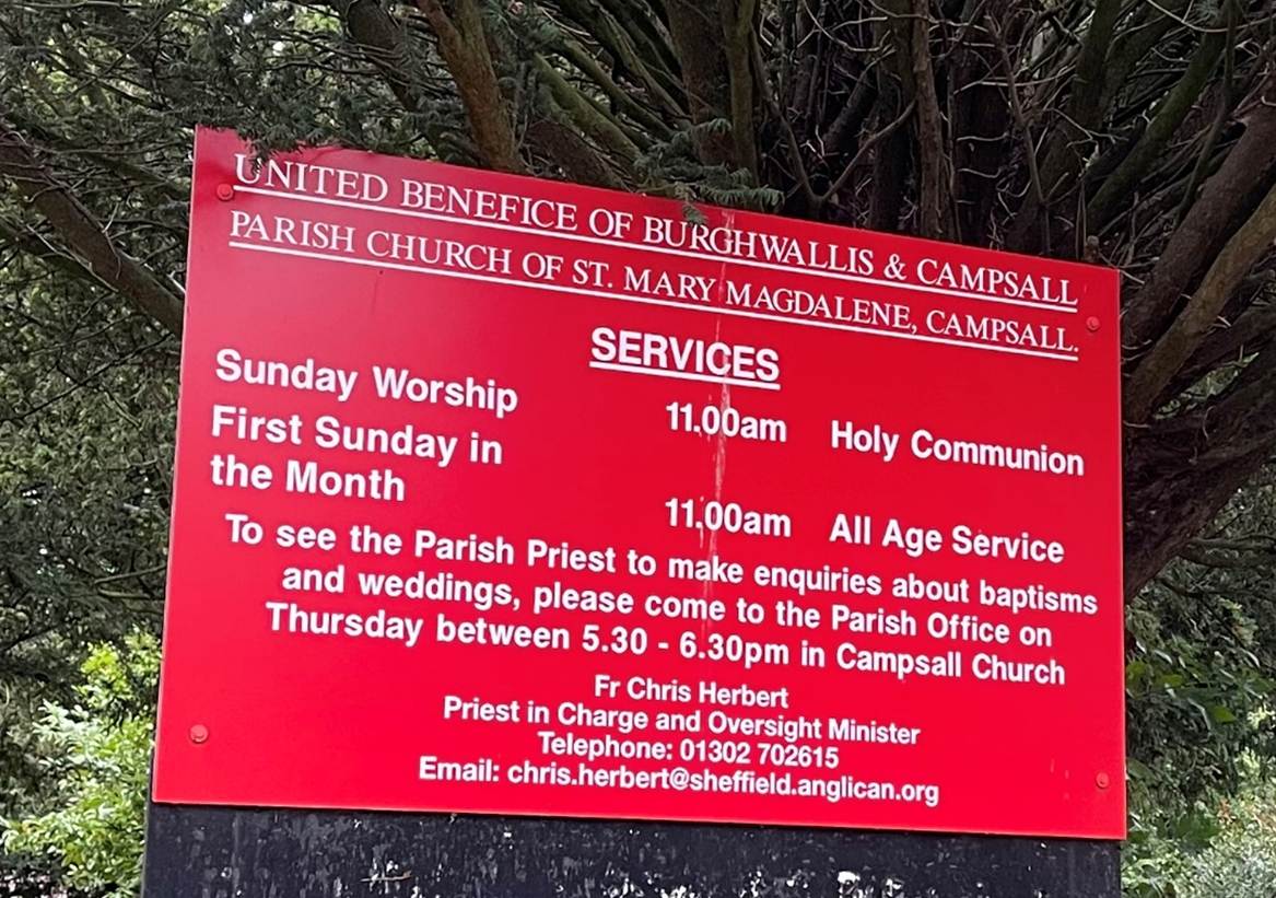 A sign in a park

Description automatically generated