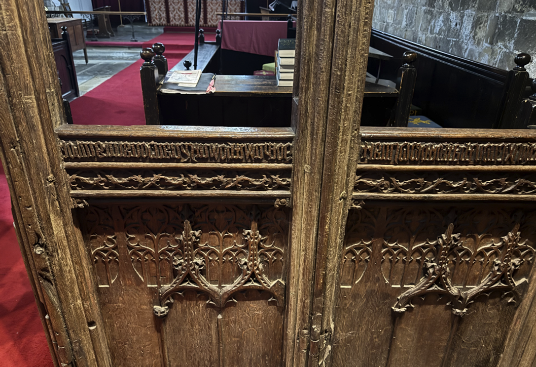 A wooden door with a red carpet

AI-generated content may be incorrect.