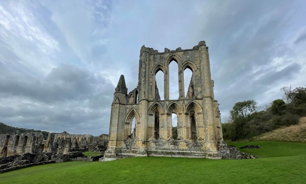 A stone building with arches and windows

Description automatically generated with medium confidence