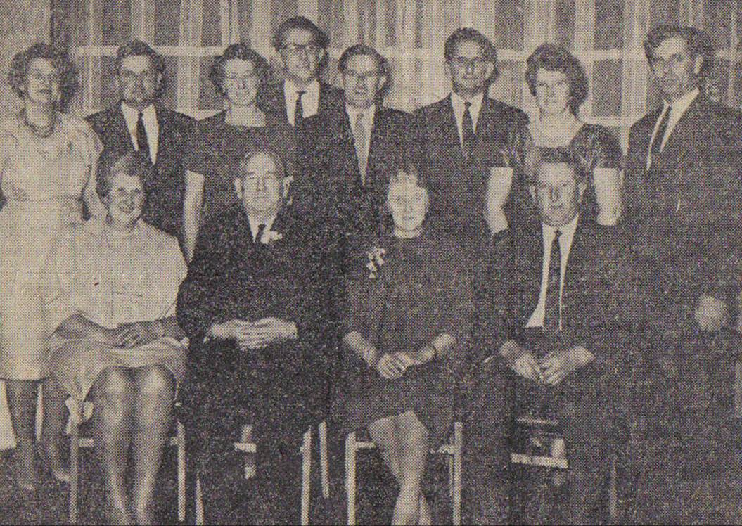 A group of people posing for a photo
Description automatically generated