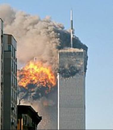 A two tall buildings on fire
Description automatically generated