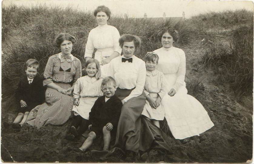 A group of people posing for a photo
Description automatically generated