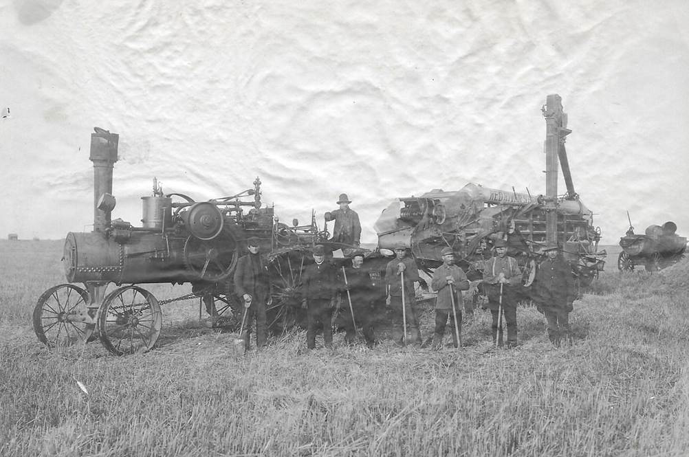 A picture containing photo, grass, old
Description automatically generated