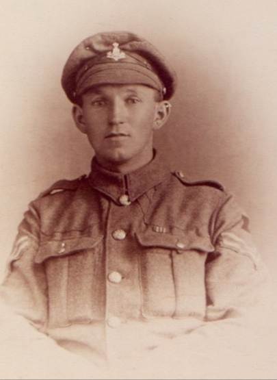 A person in a uniform
Description automatically generated
