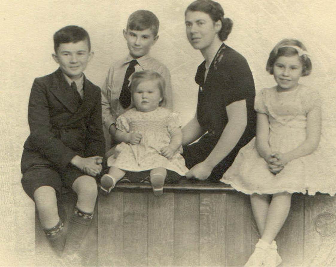 A group of people posing for a photo
Description automatically generated