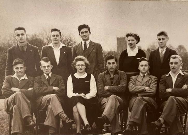 A group of people posing for a photo
Description automatically generated