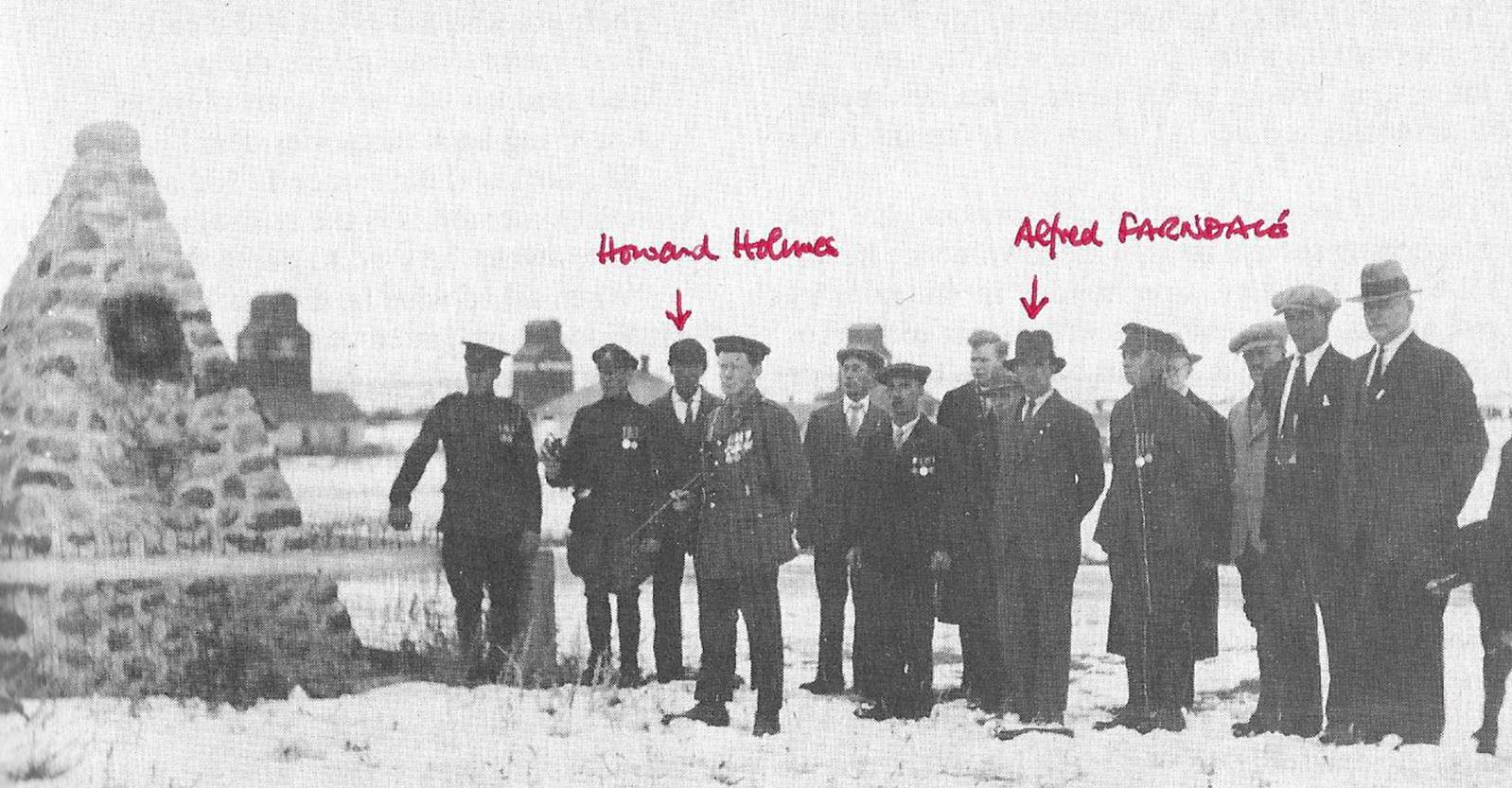 A group of men standing in a line
Description automatically generated