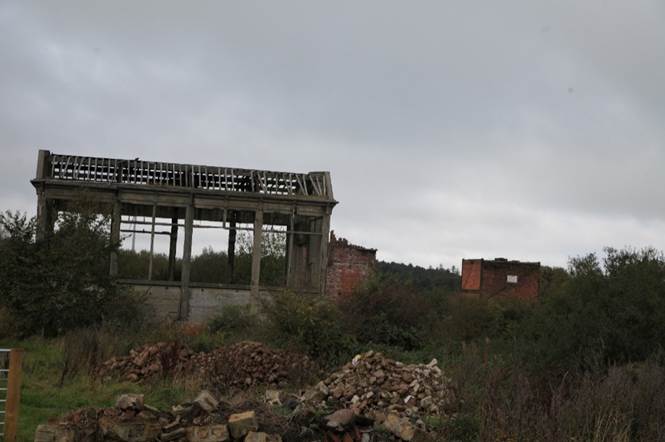 A ruined building with a few rubble
Description automatically generated with medium confidence