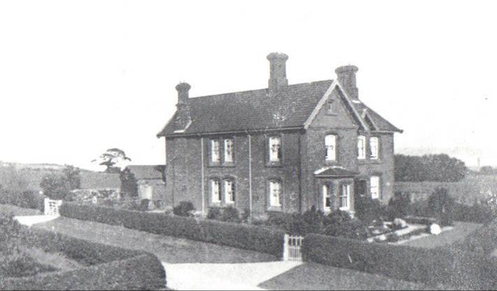 A black and white photo of a house and some trees

Description automatically generated with low confidence