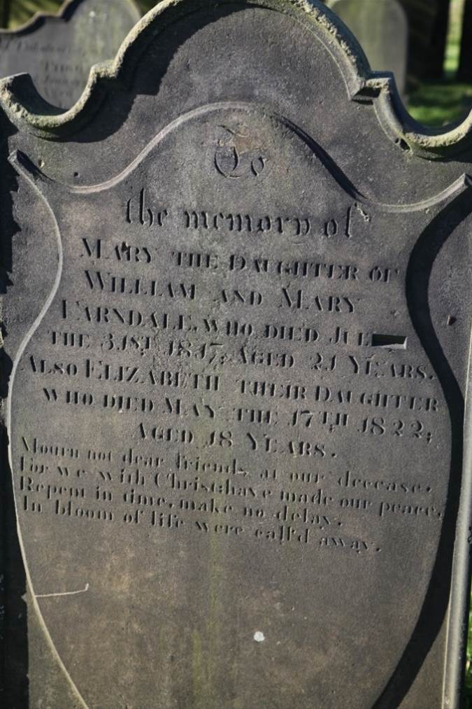 A close-up of a tombstone

Description automatically generated