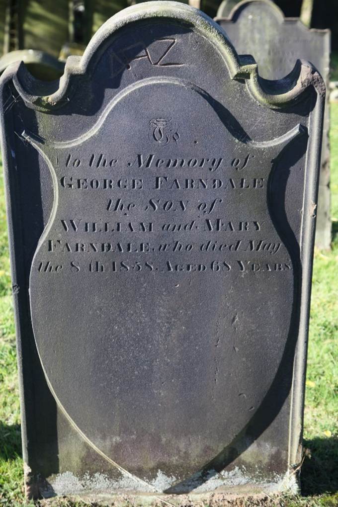 A close-up of a grave stone

Description automatically generated