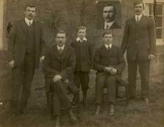 A group of men in suits

Description automatically generated